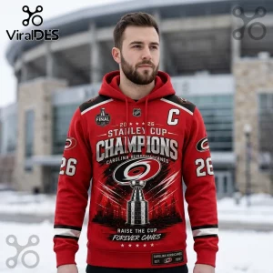 Carolina Hurricanes red hoodie with 2026 Stanley Cup Champions graphic, featuring the trophy, team logo, and number 26.!