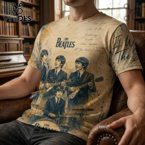 The Beatles cream-colored t-shirt featuring band members, song titles, and musical notes in a vintage watercolor print.!