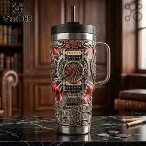 Slayer band insulated tumbler with guitar graphics, lightning background, and Reign in Blood text on a marble surface.!
