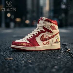 Kappa Alpha Psi Air Jordan 1 sneaker in cream and red leather with 1911 embroidery and fraternity crest on blurred street.!