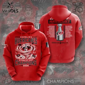 Red Carolina Hurricanes Stanley Cup 2026 champions hoodie with graphic swirl, trophy, and team roster print.!