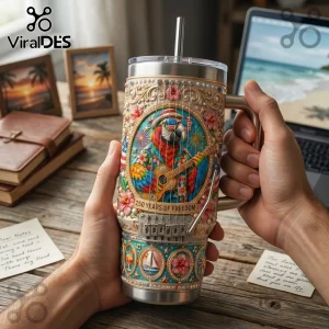 Stainless steel tumbler featuring a parrot, guitar strings, tropical flowers, and text 250 YEARS OF FREEDOM on a desk.!