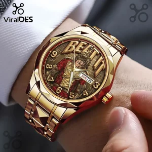 Gold-toned metal wristwatch featuring Michael Jackson Beat It graphic on the dial with gold hour markers and day-date window.!