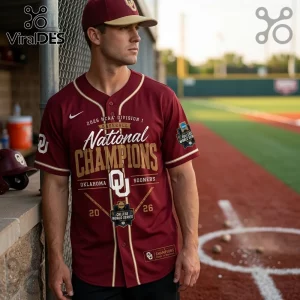 Man wearing crimson Oklahoma Sooners 2026 National Champions baseball jersey with gold lettering and official NCAA patches.!