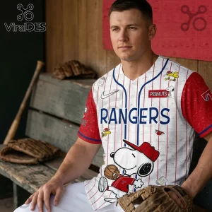 Texas Rangers baseball jersey with red sleeves and Peanuts Snoopy character print sitting on a wooden dugout bench.!