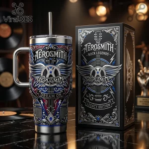 Aerosmith branded stainless steel tumbler with straw and matching decorative gift box on a black marble surface.!