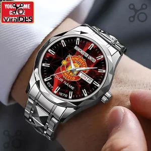 Stainless steel wristwatch with Manchester United logo, black and red dial, and day-date calendar display.!
