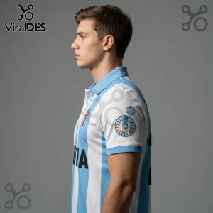 Man wearing a light blue and white vertical striped polo shirt with circular sports patches on the sleeve.!