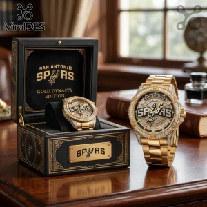 San Antonio Spurs gold wristwatch with diamond-encrusted bezel in a black leather presentation box on a wooden desk.!