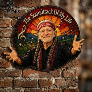 Willie Nelson circular stained glass art with text The Soundtrack Of My Life mounted on an exterior red brick wall.!