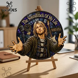 Circular stained-glass style portrait of Kurt Cobain with text The Soundtrack Of My Life and Nirvana on a wooden easel.!