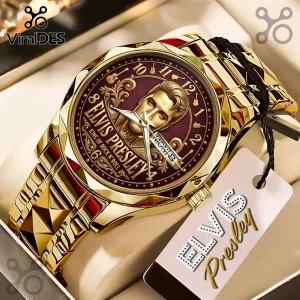 Gold Elvis Presley wristwatch with a deep burgundy face, featuring an embossed portrait and guitar hour markers.!