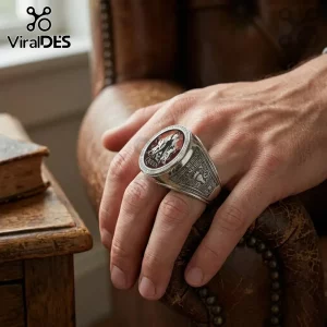Silver Freddie Mercury Queen tribute ring worn on a hand featuring an oval crest with red accents and engraved text.!