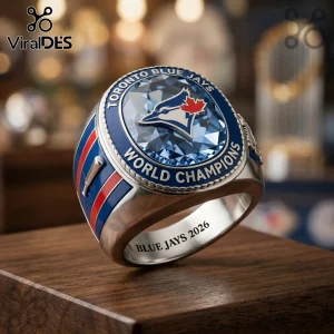 Toronto Blue Jays championship ring with a large blue faceted stone, metal band, bat detail, and engraved 2026 text.!