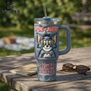 Blue insulated stainless steel tumbler with a 3D Tom the cat relief, a straw lid, and Tom and Jerry branding text.!