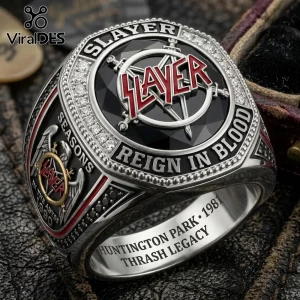 Slayer band silver championship ring with red logo, black stone center, and engraving reading Reign in Blood on leather.!