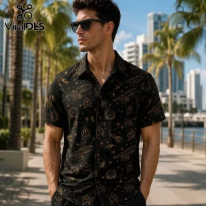 Man wearing a black short-sleeve button-up shirt with gold Star Trek starship and insignia patterns in a city setting.!