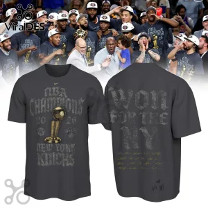 Charcoal grey New York Knicks NBA Champions 2026 t-shirt featuring Larry O'Brien trophy graphic and team signatures.!