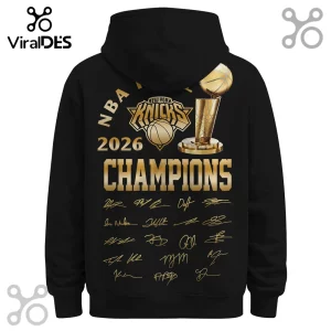 Black hooded sweatshirt with gold New York Knicks 2026 Champions graphic, championship trophy, and player signatures.!