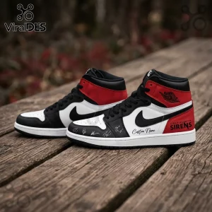 Custom high-top sneakers in white, black, and red leather with Sleeping With Sirens branding on a wooden plank background.!