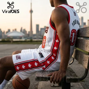 Man wearing a white Toronto Tempo basketball jersey and shorts with red maple leaf patterns, sitting on a wooden bench.!