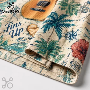 Beige cotton fabric with tropical print featuring guitars, palm trees, compass, hibiscus flowers, and text Fins Up.!