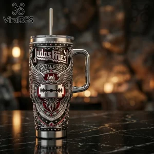 Judas Priest Metal Gods stainless steel tumbler with razor blade emblem, red accents, and silver wings on marble surface.!