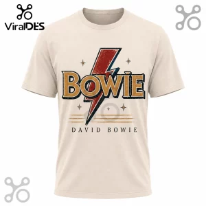 Cream colored short sleeve cotton t-shirt featuring a distressed red lightning bolt and gold Bowie graphic text.!