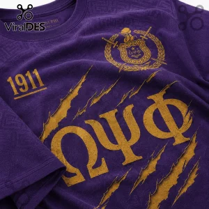 Purple Omega Psi Phi t-shirt with gold Greek letters, 1911, and crest graphic featuring a claw-mark distress effect.!