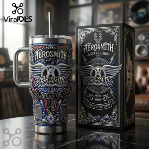Aerosmith stainless steel tumbler with Dream On text and guitar emblem beside a matching black collector box.!