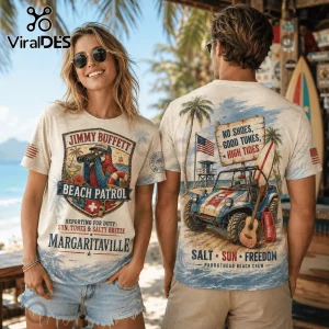 Cream-colored graphic t-shirt featuring Jimmy Buffett Beach Patrol artwork with a parrot, vintage jeep, and beach scenery.!