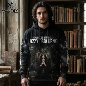 Man wearing black Ozzy Osbourne hoodie with Prince of Darkness text, stained glass graphic, and vintage library background.!