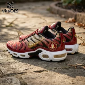 Nike Air Max Plus sneakers in crimson and gold with Kappa Alpha Psi fraternity emblem on a stone patio background.!