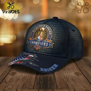 New York Knicks 2026 Champions baseball cap with embossed texture, gold trophy emblem, and American flag graphic on brim.!