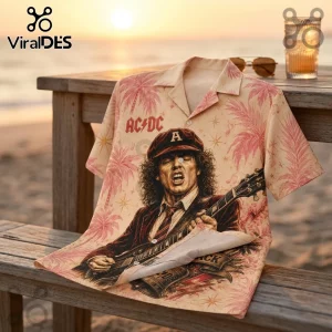 AC/DC button-down shirt featuring Angus Young portrait, palm tree print, and rock band logo on a wooden beach table.!