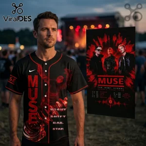 Man wearing black and red button-up Muse baseball jersey featuring band graphics and tour dates against concert background.!