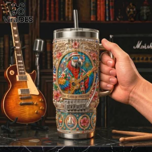 Stainless steel tumbler featuring 3D parrot illustration, guitar strings, and 250 Years of Freedom text on cream background.!