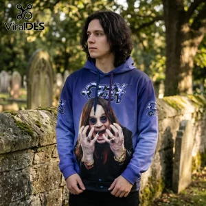 Man wearing a purple Ozzy Osbourne graphic hoodie featuring a photo print of the musician in front of a stone graveyard.!