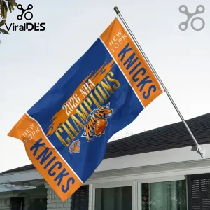 New York Knicks 2026 NBA Champions flag in orange and blue with team logo, mounted on a pole against a house exterior.!