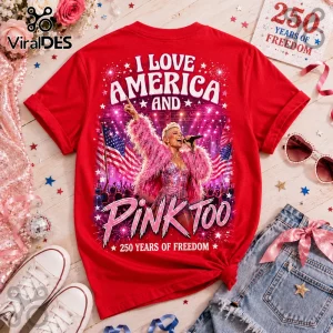 Red graphic t-shirt featuring pop singer P!nk, American flags, fireworks, and text I Love America and Pink Too.!