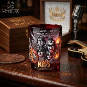 KISS rock band red whiskey glass featuring printed portraits of band members, fire graphics, and lyrics on a wooden desk.!