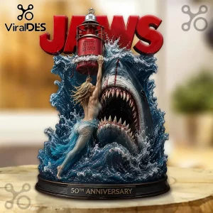 Jaws 50th anniversary resin statue featuring a great white shark, a woman holding an Amity Island lantern, and blue waves.!
