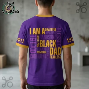 Purple t-shirt with yellow collar and cuffs featuring gold and purple typography reading I AM A BLACK DAD.!