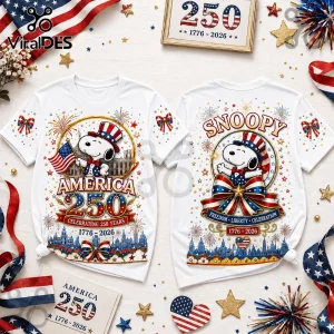Snoopy US 250th anniversary graphic t-shirt featuring patriotic stars, stripes, fireworks, and the years 1776-2026.!