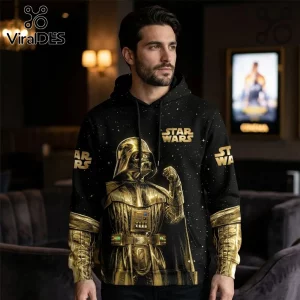 Black hoodie with metallic gold Darth Vader graphic and Star Wars logo against a starry space background.!