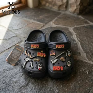 Black clog sandals featuring KISS band logos, face makeup charms, guitar charms, and Rock and Roll All Nite text on stone.!