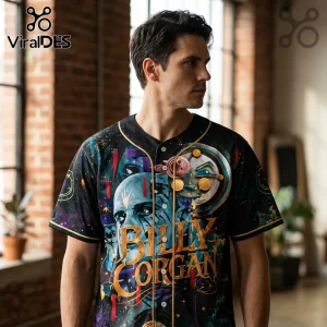 Man wearing a black baseball jersey with colorful Billy Corgan space-themed graphic print and gold trim details.!