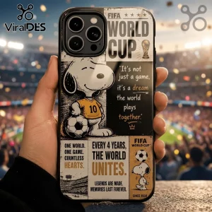 Snoopy soccer phone case featuring FIFA World Cup branding, yellow jersey, and text on a blurred stadium background.!