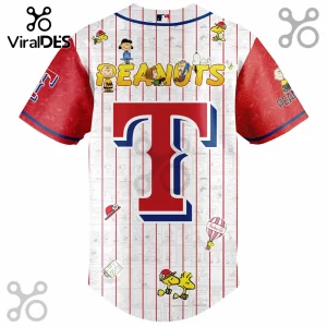 Texas Rangers baseball jersey with Peanuts comic strip print, red and blue team T logo, and Snoopy graphics on white fabric.!