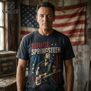 Bruce Springsteen t-shirt with vintage American flag graphic, guitar player illustration, and 250 text on charcoal cotton.!